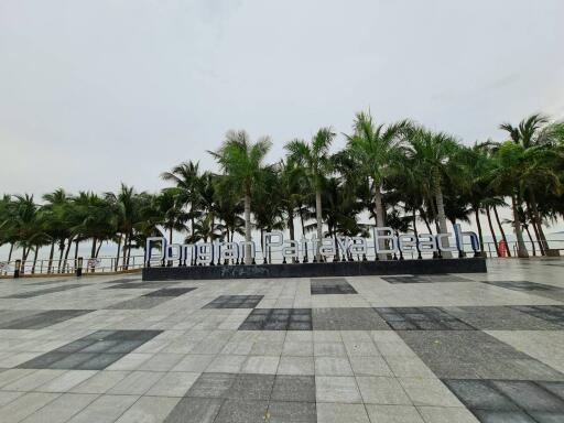 Dongan Pattaya Beach with palm trees and ocean view