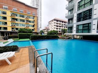 Outdoor swimming pool with nearby buildings