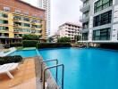 Outdoor swimming pool with nearby buildings