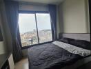 Bedroom with a view of the city