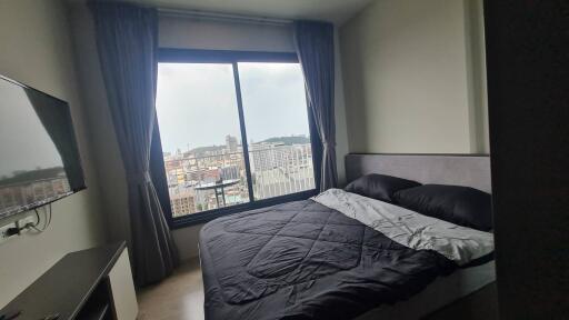 Bedroom with a view of the city