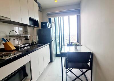 Modern kitchen with appliances and dining area