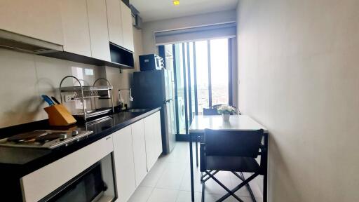 Modern kitchen with appliances and dining area