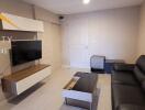 Modern living room with sofa and wall-mounted TV