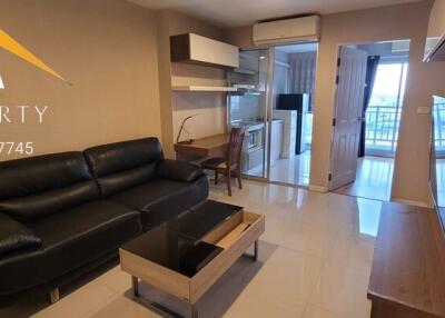 Living room with black leather sofa and modern furniture