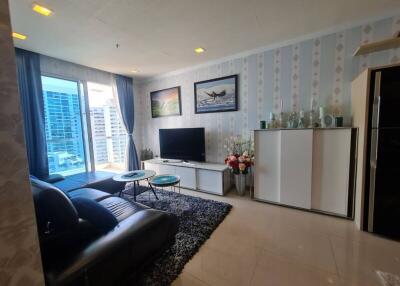 Modern living room with large window and city view