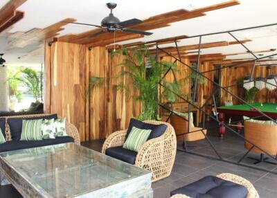 Stylish living room with wooden accents and indoor plants