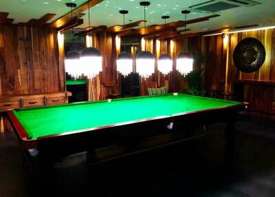 Luxurious billiard room with modern lighting