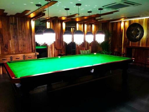 Luxurious billiard room with modern lighting