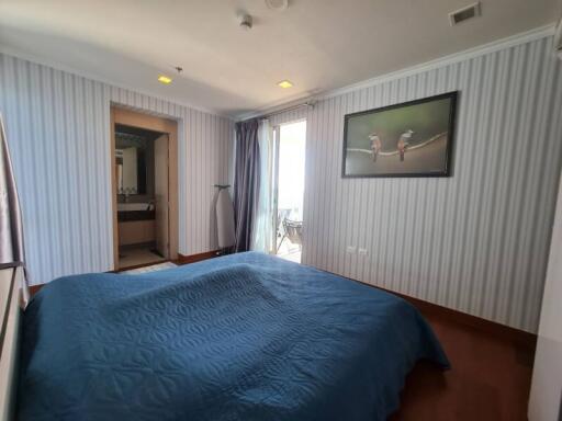 Bedroom with a view and adjacent bathroom