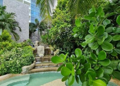 Outdoor landscaped area with pool