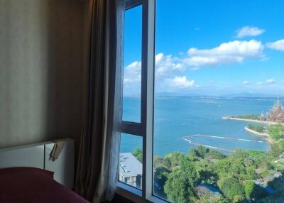 Bedroom with a view of the ocean and surrounding scenery