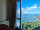 Bedroom with a view of the ocean and surrounding scenery