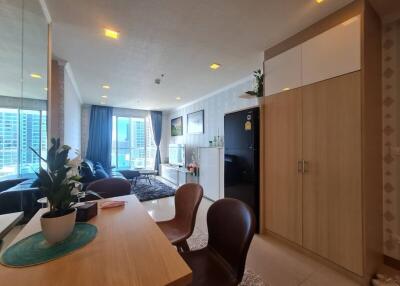 Modern living room with dining area and large windows