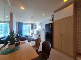 Modern living room with dining area and large windows