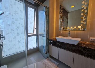 Modern bathroom with large window and stylish vanity