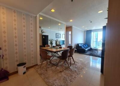 Modern living room with dining area and large windows