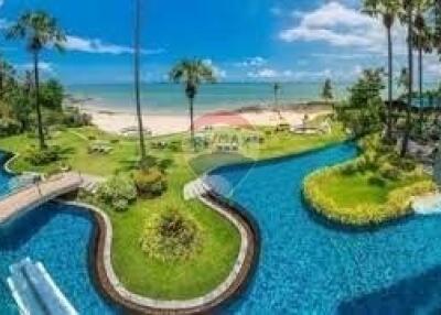 A beautiful outdoor area with a pool and a view of the beach