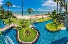 A beautiful outdoor area with a pool and a view of the beach