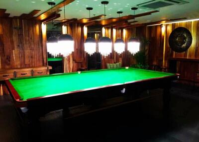 Luxurious game room with billiard table