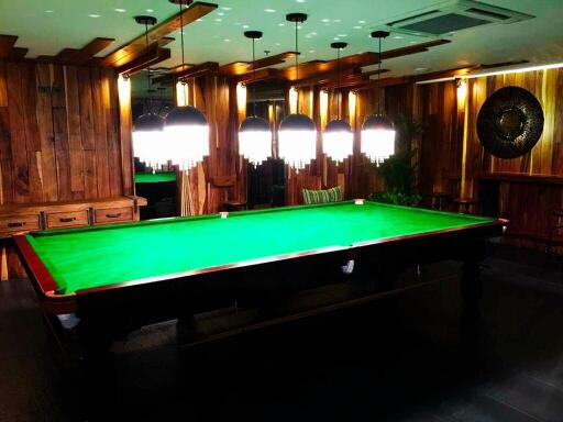 Luxurious game room with billiard table