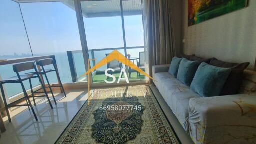 Living room with ocean view and balcony