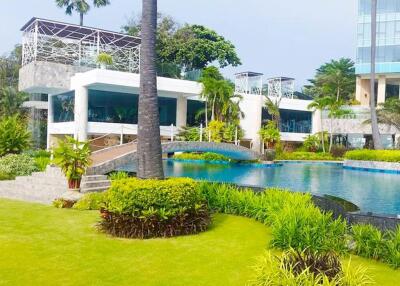 Modern building with landscaped garden and swimming pool