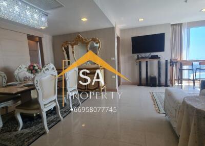 Elegant living room with dining area and large windows