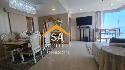 Elegant living room with dining area and large windows