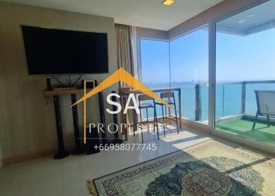 Living room with large windows and sea view