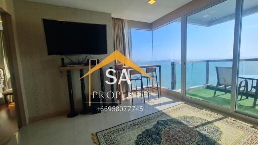 Living room with large windows and sea view