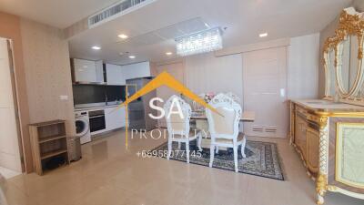 Elegant living area with kitchen and dining space