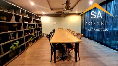 Modern dining room with a long table and chairs