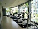 Modern gym with cardio equipment in a residential building