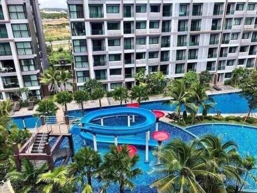 Aerial view of a modern residential complex with a swimming pool