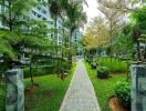 Lush green garden pathway in residential complex