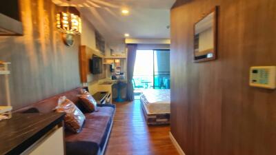 Modern bedroom with wooden accents and balcony view