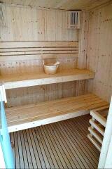 Wooden sauna interior with seating benches