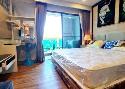 Spacious bedroom with balcony access