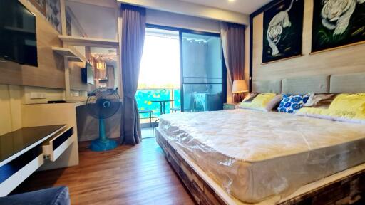 Spacious bedroom with balcony access