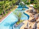 outdoor swimming pool and relaxation area with sunbeds and greenery