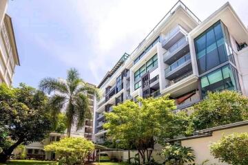 Modern apartment building with surrounding greenery