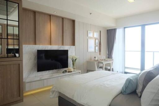 Modern bedroom with TV and dining area