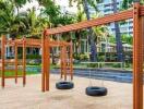 Outdoor playground area with tire swings and climbing structure