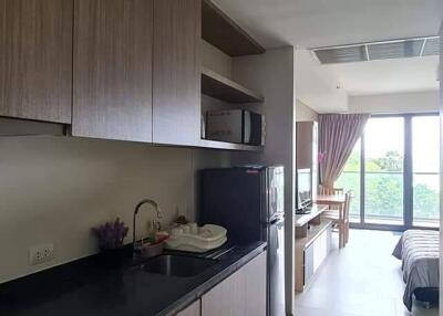 Modern kitchen area leading to a cozy living space