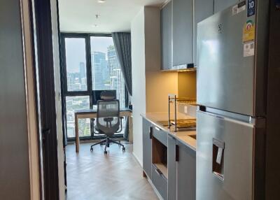 Modern kitchen with city view and workspace