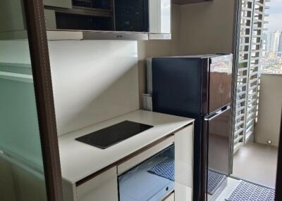 Modern kitchen with built-in appliances and a view