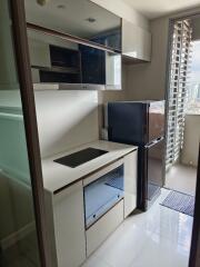 Modern kitchen with built-in appliances and a view