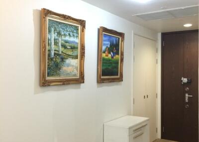 Hallway with framed paintings