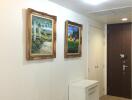 Hallway with framed paintings